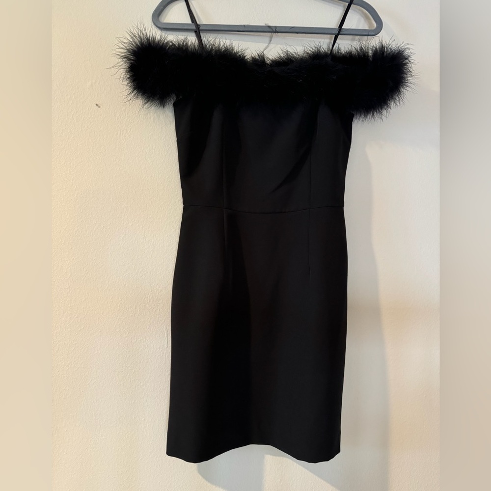 Gianni Bini black feather mini off shoulder dress. Crepe sheath material. NWT